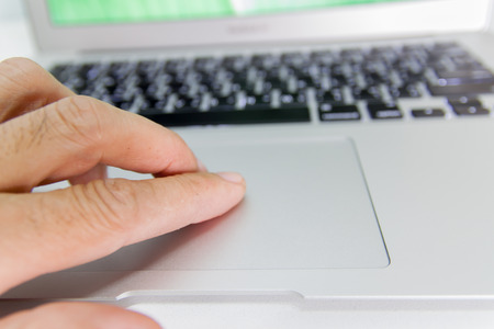 working on laptop, hands typingの写真素材