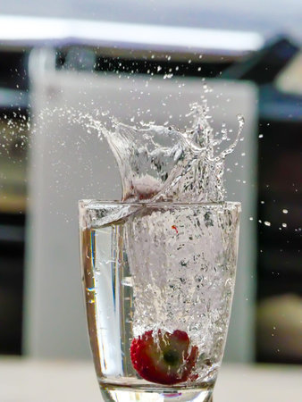 Strawberry Water splash in glassの写真素材