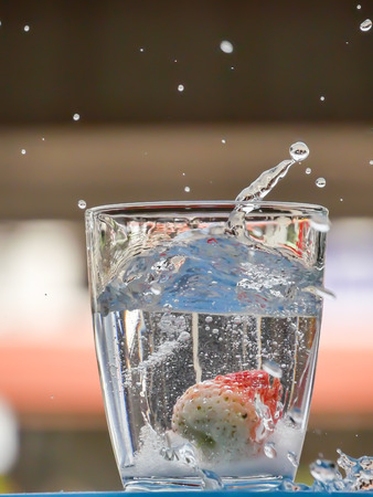 Strawberry Water splash in glassの写真素材