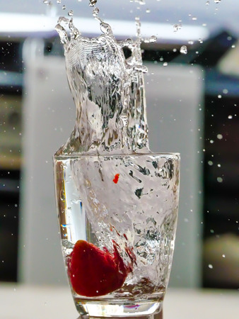 Strawberry Water splash in glassの写真素材