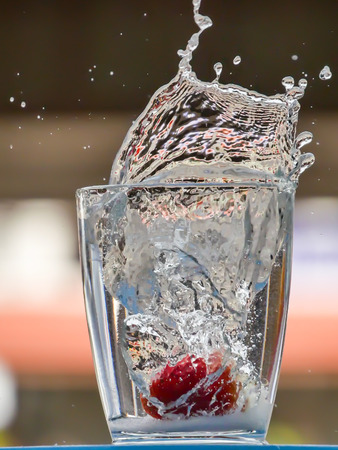 Strawberry Water splash in glassの写真素材