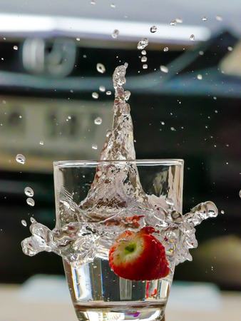 Strawberry Water splash in glassの写真素材