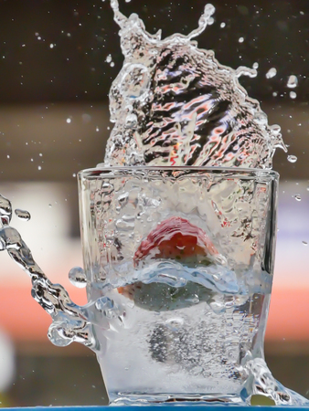 Strawberry Water splash in glassの写真素材