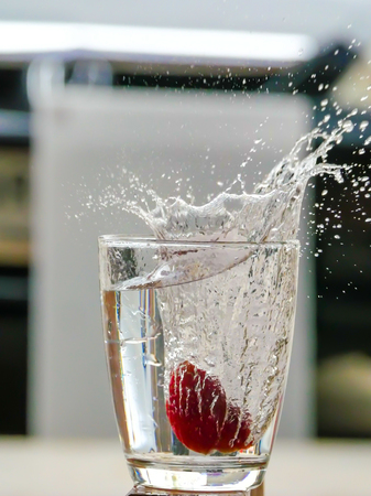 Strawberry Water splash in glassの写真素材