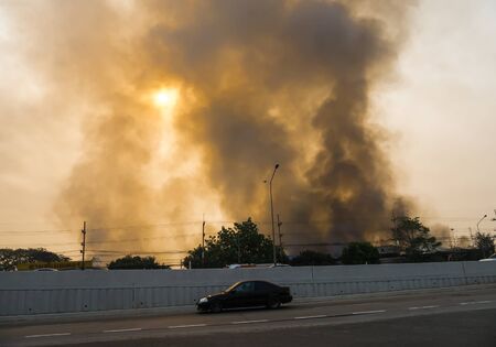 Lamphun, Thailand - April 9, 2016: During the morning April 9, 2016. Fire recycling warehouse, causing a large flame and smoke in the air is very hot days. Firemen rush to help prevent the spread of fire , In Thailand.のeditorial素材