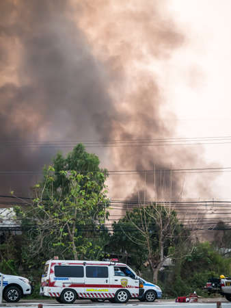 Lamphun, Thailand - April 9, 2016:Fire recycling warehouse, causing a large flame and smoke in the air is very hot days. Firemen rush to help prevent the spread of fire , In Thailand.のeditorial素材