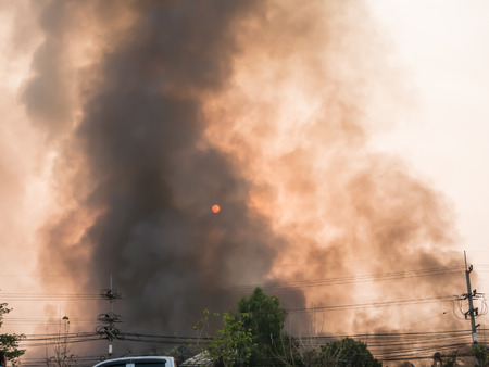 Lamphun, Thailand - April 9, 2016:Fire recycling warehouse, causing a large flame and smoke in the air is very hot days. Firemen rush to help prevent the spread of fire , In Thailand.のeditorial素材