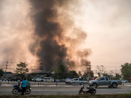 Lamphun, Thailand - April 9, 2016: During the morning April 9, 2016. Fire recycling warehouse, causing a large flame and smoke in the air is very hot days. Firemen rush to help prevent the spread of fire , In Thailand.のeditorial素材