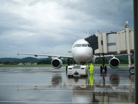 Chiang Mai, Thailand - June 14, 2016:Aircraft landing and takeoff. at Chiang Mai international airport  rainy day on June 14, 2016 in Chiang Mai, Thailand.のeditorial素材