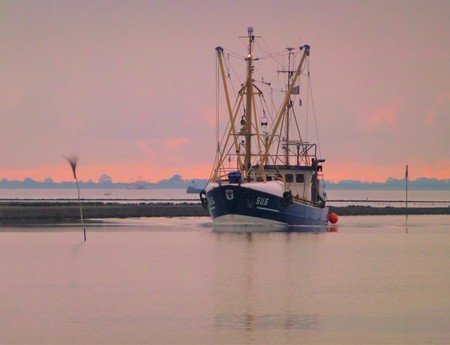 Ship returning from the north sea near Husum, Germanyの写真素材