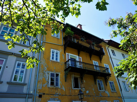 Beautiful yellow residential home in Hribarjevo nabrezje Ljubljana, Sloveniaの写真素材