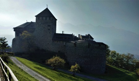 Idyllic view on Vaduz castle on a foggy morningの写真素材