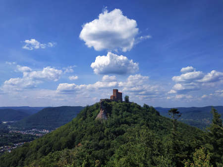 Interesting cloud formation over the Trifels castle located on a hill topのeditorial素材