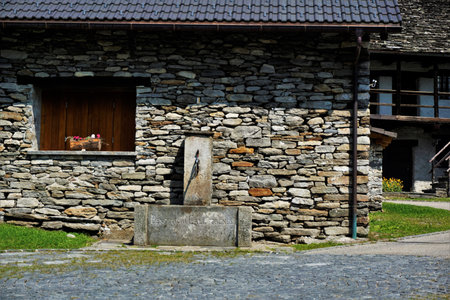 Fountain in the picturesque village center of Frasco, Verzasca Valley, Ticino, Switzerlandの写真素材