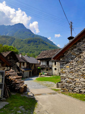 Piazzetta Torbola in Frasco, Ticino, Switzerland in front of mountain panoramaの写真素材