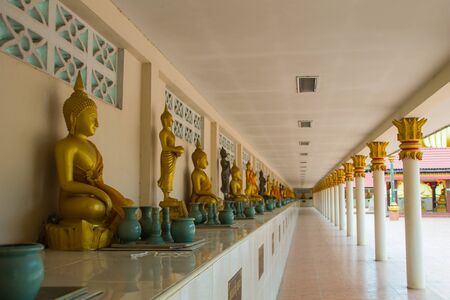 Buddha is a long row of people to worship represents a devout Buddhist Thailand.の写真素材