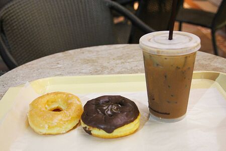 2 pieces 1 cup cold coffee and donuts.の写真素材