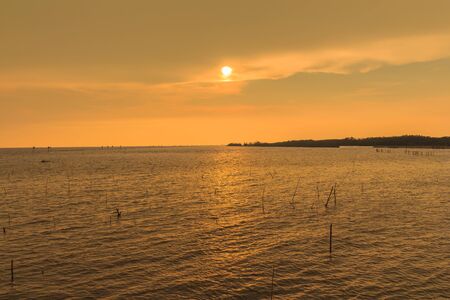 Orange sunset over the seaの写真素材