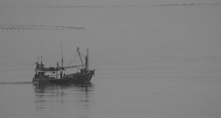 Black and white images of small boats in the sea,の写真素材