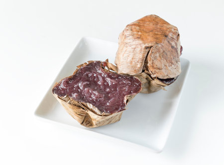 Traditional Basket shaped Chinese pudding Sweetmeat on white dish 