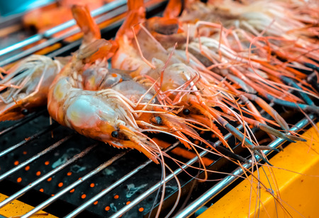 Grilled prawns on the electricity grill in fresh food marketの写真素材