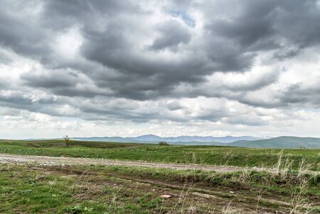 Storm over spring agricultural fields. Aksu dzhabaglyの写真素材