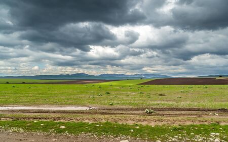 Storm over spring agricultural fields. Aksu dzhabaglyの写真素材