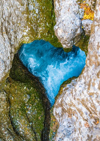 a river in a canyon in the shape of a heart.の写真素材