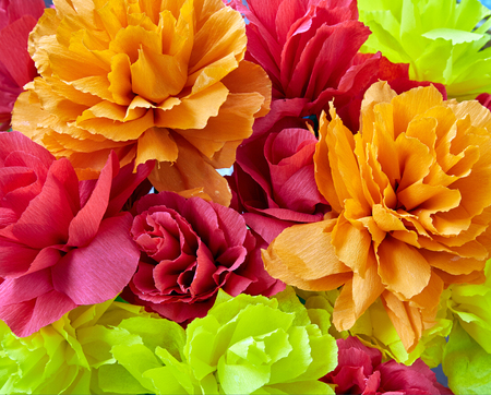 Red yellow flowers made of paper backgroundの写真素材