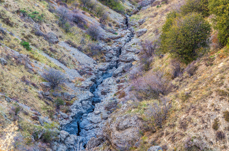 A large crack in the ground, a tectonic slab fault.の写真素材