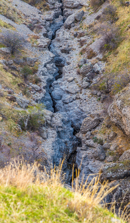 A large crack in the ground, a tectonic slab fault.の写真素材