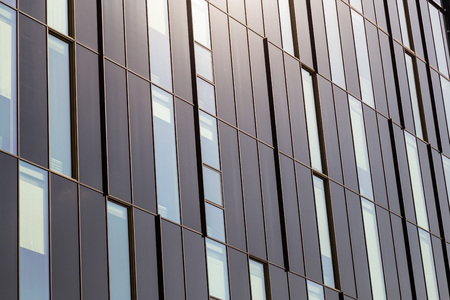 Windows of a modern high-tech building close-up, like a background.の写真素材