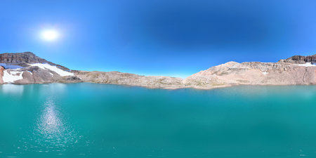The panorama of Lake jubilee in Kazakhstan covers a large expanse of turquoise water surrounded by rocky shores. Around the lake, the rocks emphasize the beauty and grandeur of the nature of Kazakhstaの写真素材