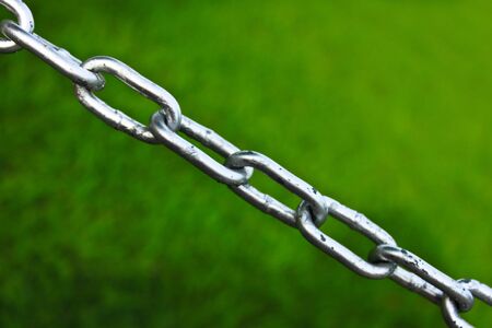 The extent of the barrier chain, green lawn.の写真素材