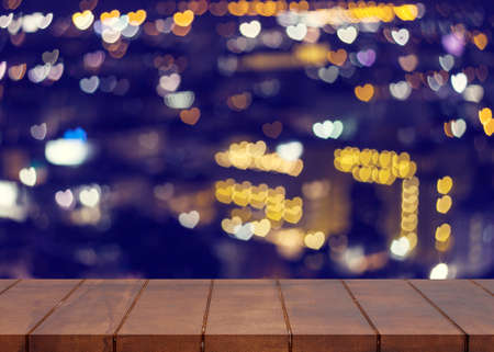 Empty wooden floor. blurred bokeh light heart background. There is an empty space for productionsの写真素材