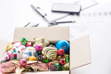 Christmas Decoration. Holiday Decoration in Box on Desk Businesman. Top Viewの写真素材