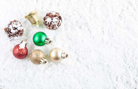 Christmas concept. Christmas decoration on snow background. Top view. With space for text yourの写真素材