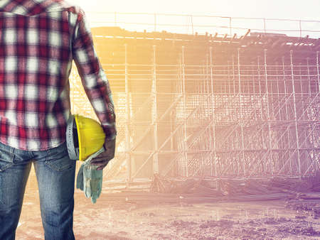 Worker man in construction site, Business construction conceptの写真素材