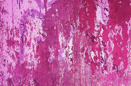 Pink wooden texture background. Peeling paint from plank floorの写真素材