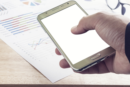 businessman holding generic desing smartphone with blank screen in hand. ready for messageの写真素材