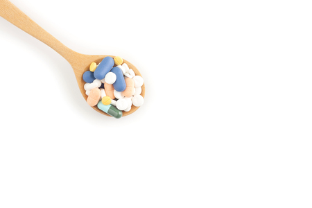 Pharmaceutical in wooden spoon on white background, Top viewの写真素材