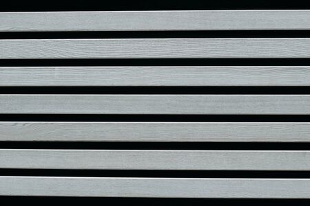 gray wooden planks on a black background. Texture for designの写真素材