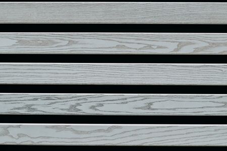 gray wooden planks on a black background. Texture for designの写真素材
