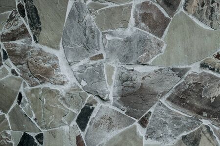 wall of natural large granite stones bonded to each other with cementの写真素材