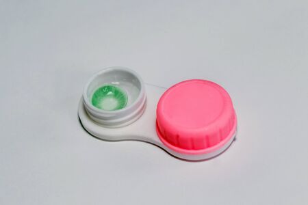 Green colored eye lens. case for contact lenses.の写真素材