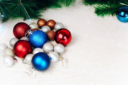 Christmas and new year tree toys. Preparing for the holidays background. Multicolored shiny Christmas tree toys. space for textの写真素材