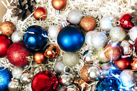 Christmas and new year tree toys. Preparing for the holidays. Multicolored shiny Christmas tree toysの写真素材