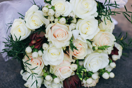 Wedding bouquet of white roses, white berries and proteaの写真素材