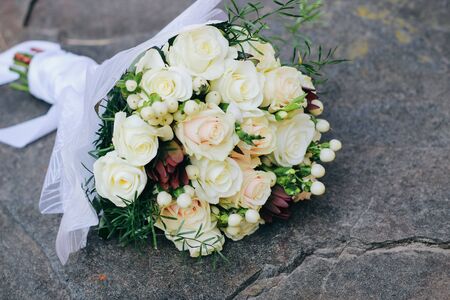 Wedding bouquet of white roses, white berries and proteaの写真素材