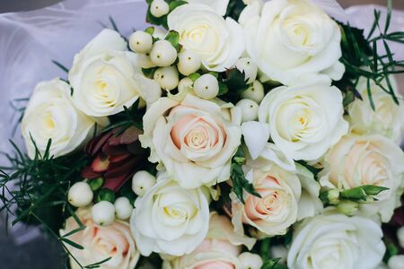 Wedding bouquet of white roses, white berries and proteaの写真素材